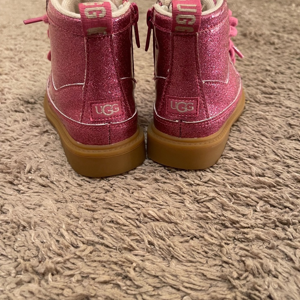 Glitter pink UGG Boots; size 9 Toddler. Zips on the side but also laces up.